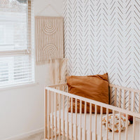 black and white chevron inspired wallpaper design for bohemian style nursery