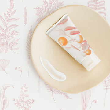 Delicate botanical design removable wallpaper with ferns in light pink color for nursery interiors