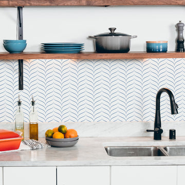 tiny chevron peel and stick backsplash in white kitchen